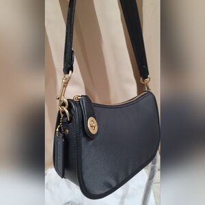 SOLD!! Coach Swinger NWT floral print interior